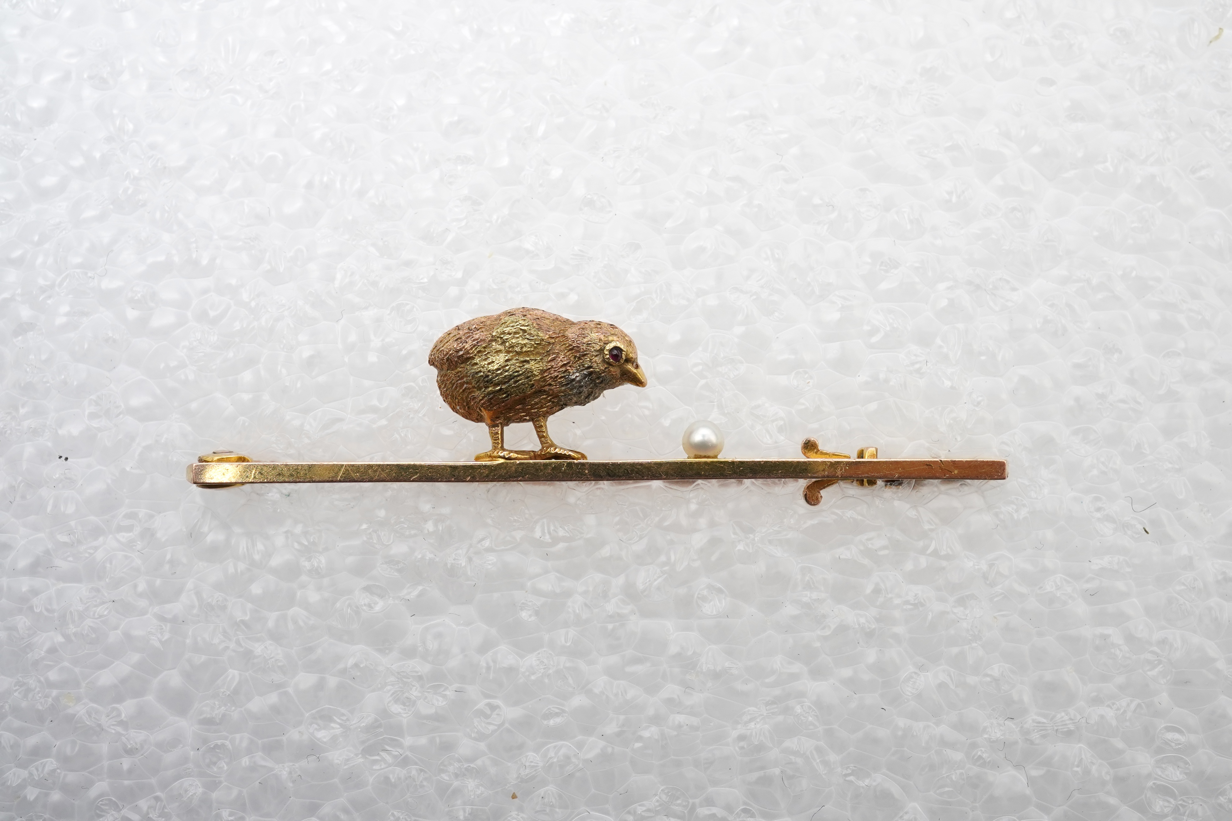 A gold and seed pearl novelty bar brooch, circa 1900
